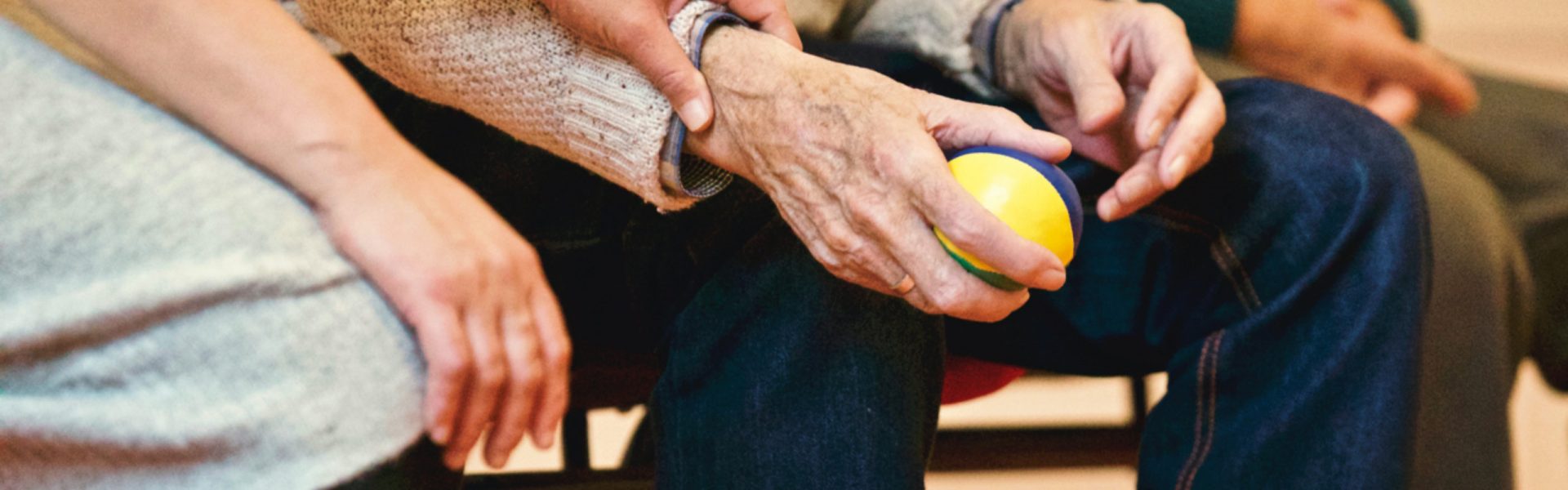 Stock photograph of a carer supporting an elderly person