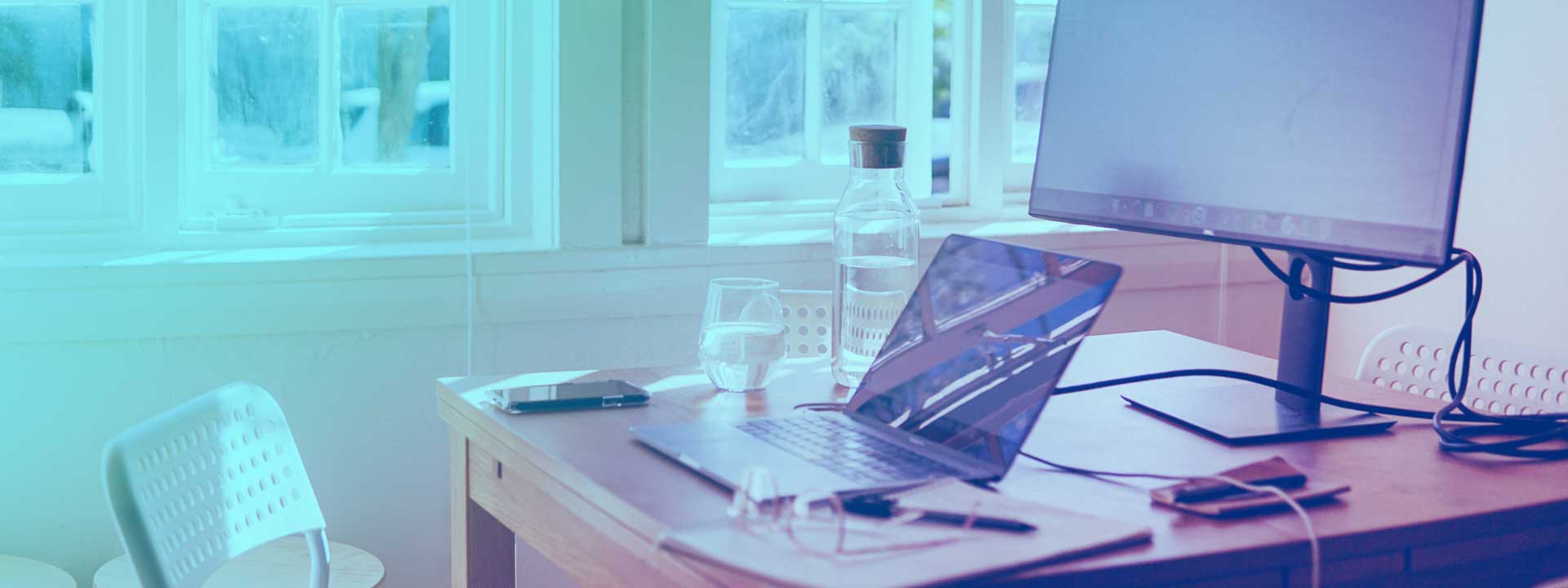 Home office desk next to a window