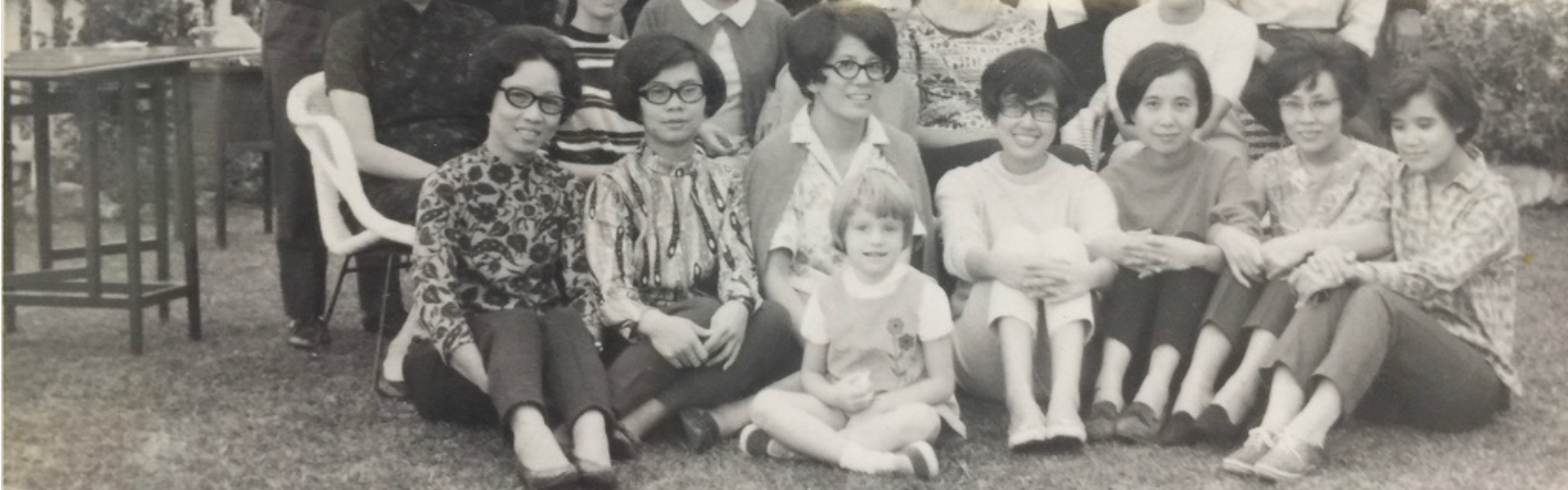 Old black and white photograph taken of a group of people in Hong Kong