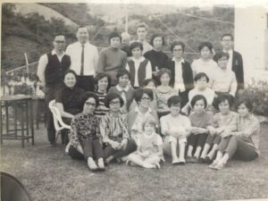 Photograph of Joy MacKeith as a child with a group of people