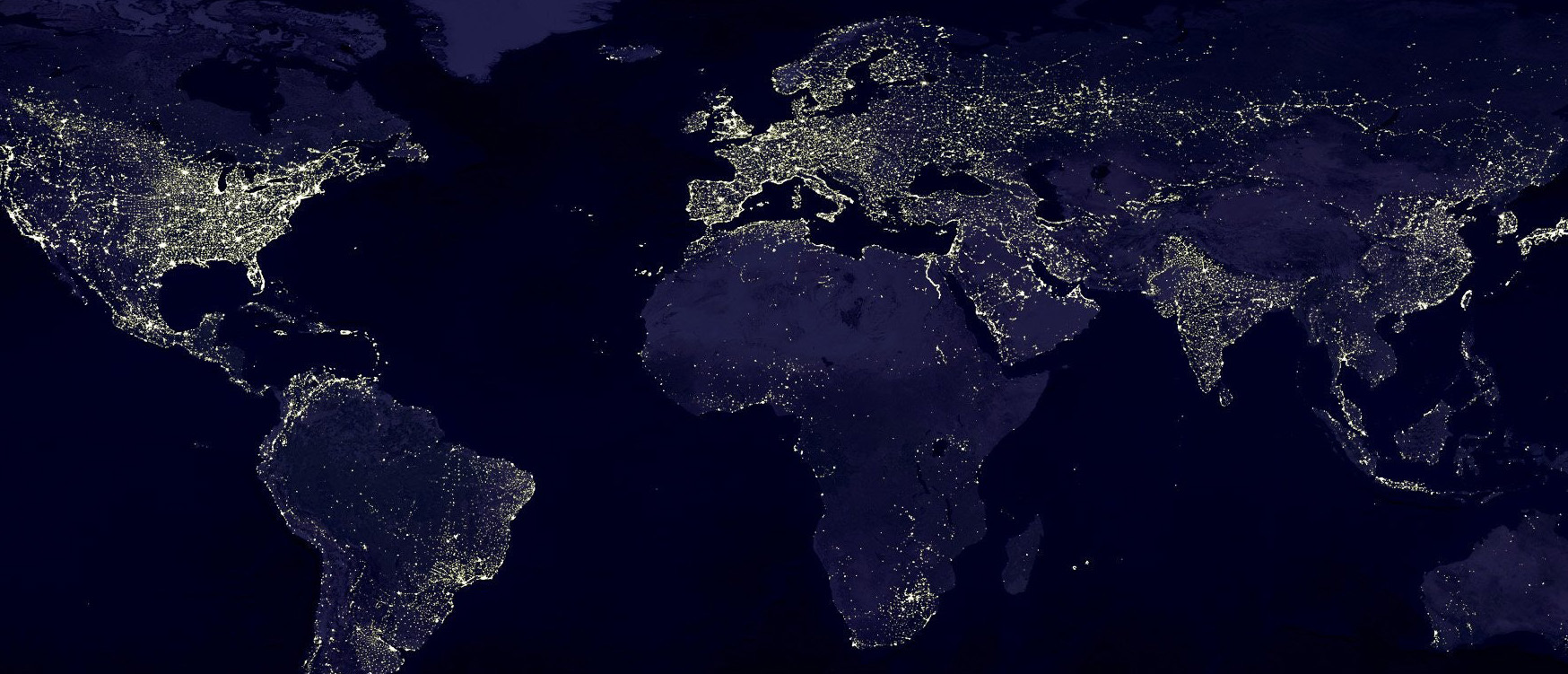 Stock photograph of a world map with lights at night